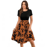 Orange knitted printed round neck short sleeve dress for women, close-up on textured knit pattern