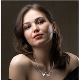 Silver-plated stainless steel imported pendant chain for women, close-up view on black background