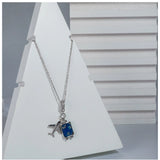 Women's stainless steel airplane design pendant on delicate silver-plated chain, aviation jewelry accessory