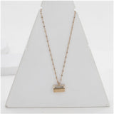 Gold-plated stainless steel mini suitcase pendant on delicate chain for women's accessories, close-up view