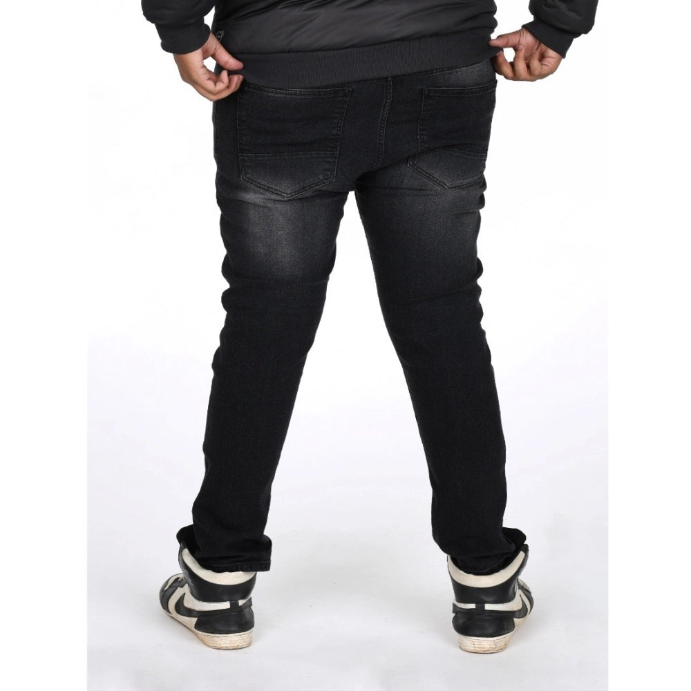 Men's cotton blended solid plus size black jeans, mid rise for men's fashionable attire on model