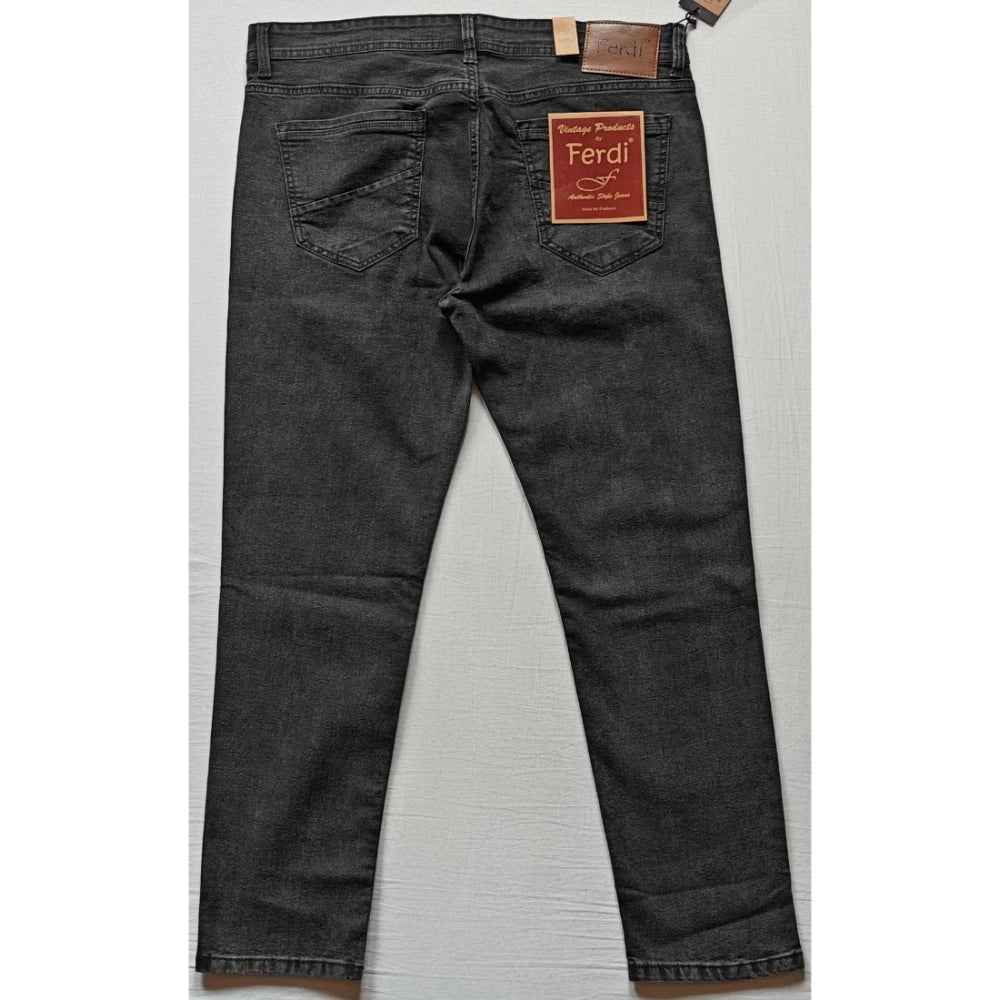 Grey cotton-blend men's tapered jeans - solid fit, mid rise style on model