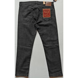 Grey cotton-blend men's tapered jeans - solid fit, mid rise style on model