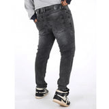 Grey cotton-blend plus size men's jeans, solid pattern with mid-rise fit on a model
