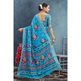Blue linen floral printed saree with unstitched blouse, vibrant flowers on a natural backdrop