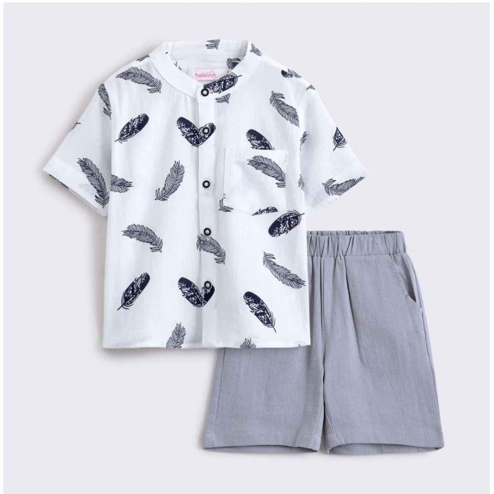White cotton blend boy's printed short sleeve shirt & shorts set for kids, vibrant pattern details on soft fabric