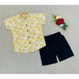 Multi-colored cotton blend boy's printed short sleeve shirt & shorts set, ideal for playtime