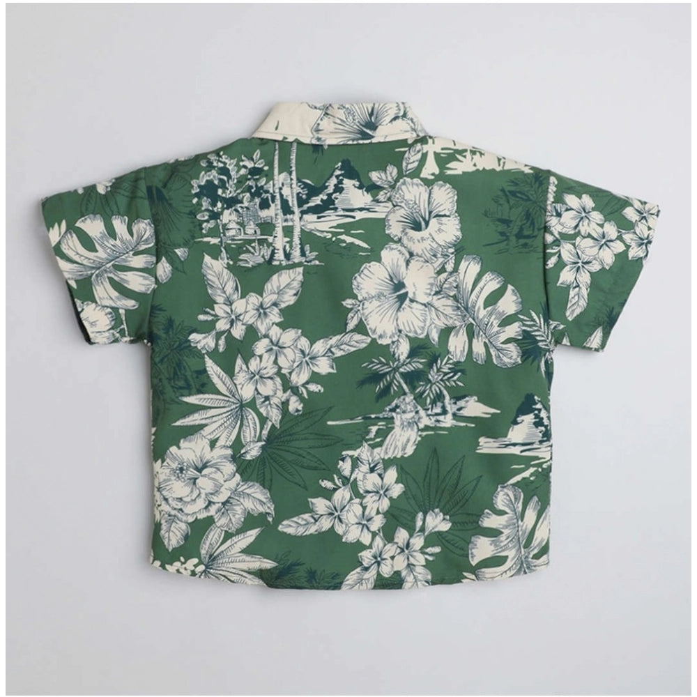 Green cotton blend printed short sleeve kid's shirt, vibrant pattern detail on display