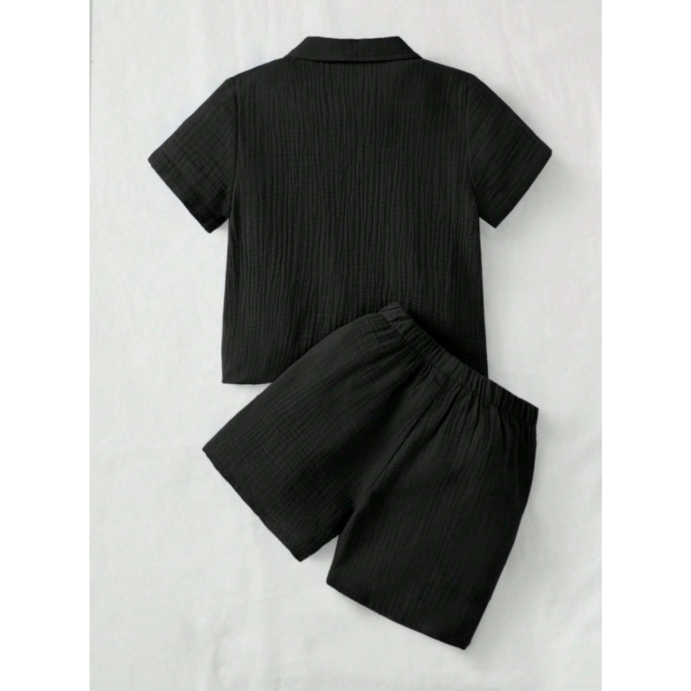 Black popcorn solid short sleeve shirt and shorts set for boys, collar neck and short sleeves, on a hanging rack
