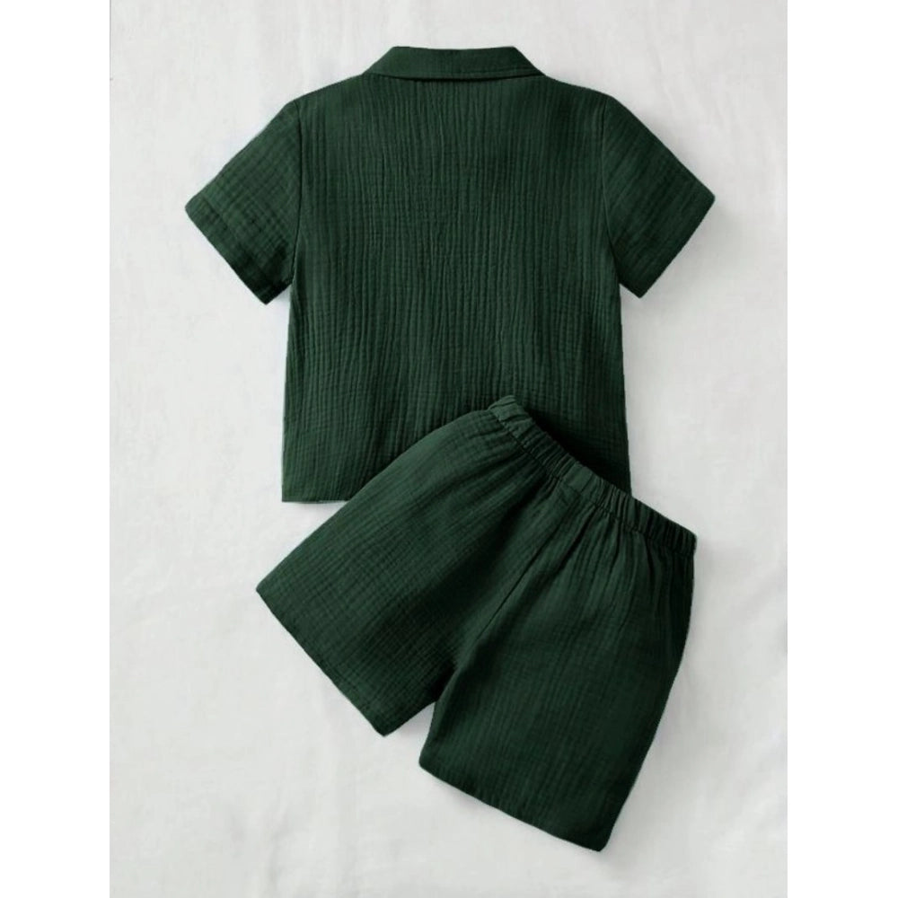 Green popcorn patterned boys' shirt-short set, solid short sleeve collar shirt and matching shorts on display rack