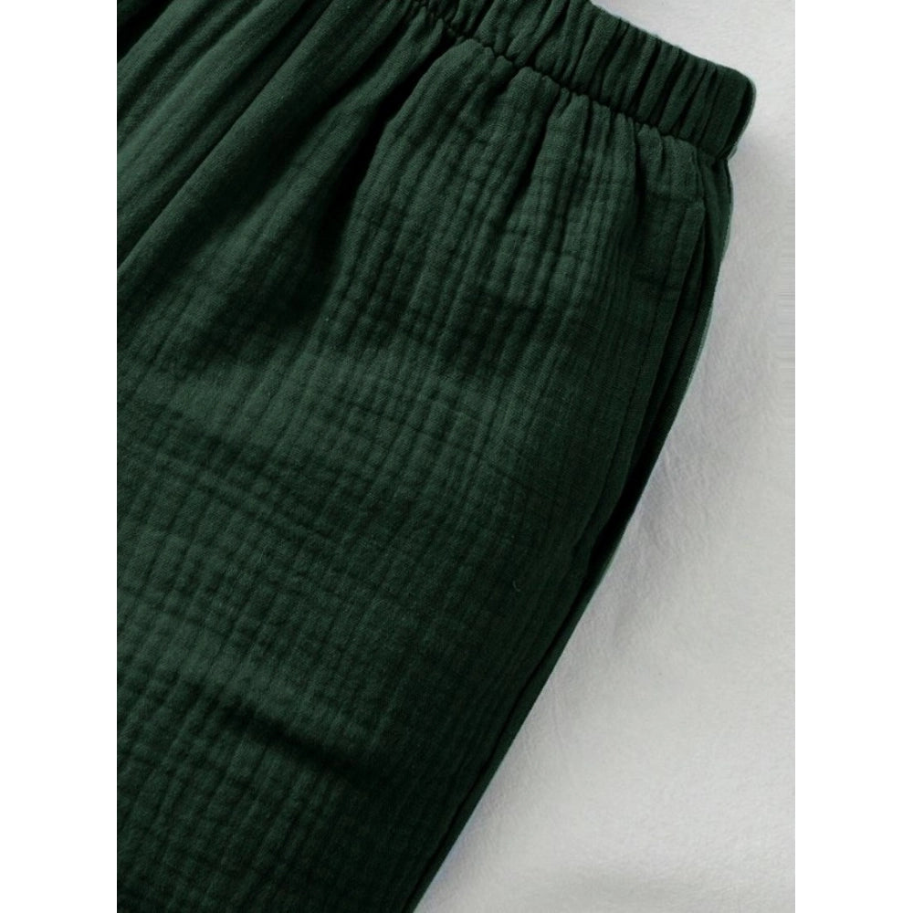 Green popcorn solid shirt & shorts set for boys, collar sleeve short sleeves patterned clothing on display