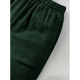 Green popcorn solid shirt & shorts set for boys, collar sleeve short sleeves patterned clothing on display