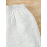 White popcorn pattern short sleeve shirt and shorts set for boys, solid design on display