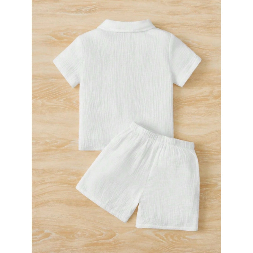 White popcorn patterned boy's short sleeve shirt and shorts set, solid design on a collared shirt with matching shorts