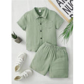 Pista popcorn pattern boy's short sleeve shirt & shorts set, solid fabric clothing on display