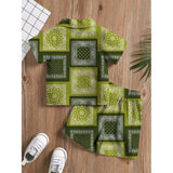 Green twill cotton printed shirt and shorts set for boys, casual summer outfit on display