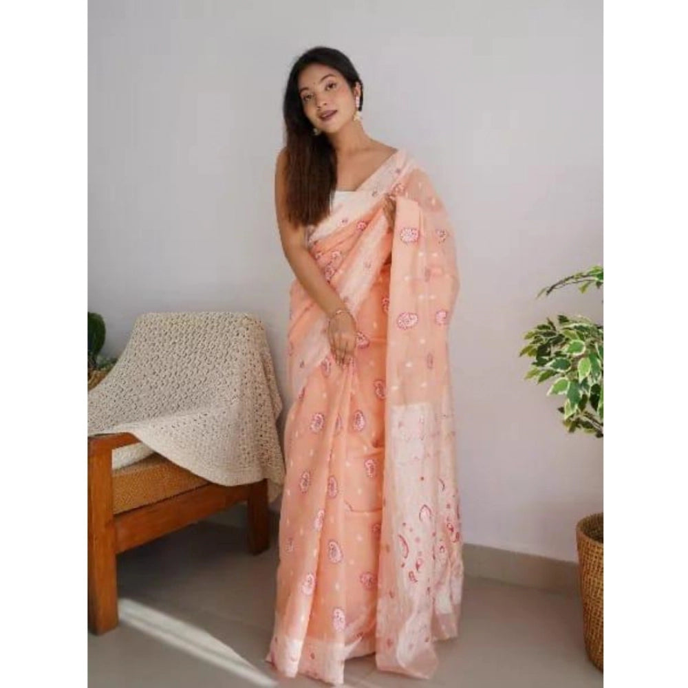 Peach cotton printed saree with unstitched blouse, vibrant floral design for traditional Indian fashion