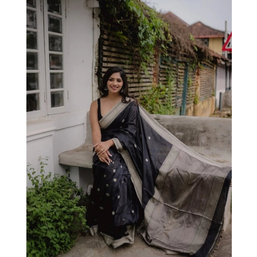 Black silk printed saree with unstitched blouse (5.5mtr) on model, intricate design details visible