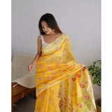 Yellow cotton printed saree with unstitched blouse, vibrant floral pattern on display