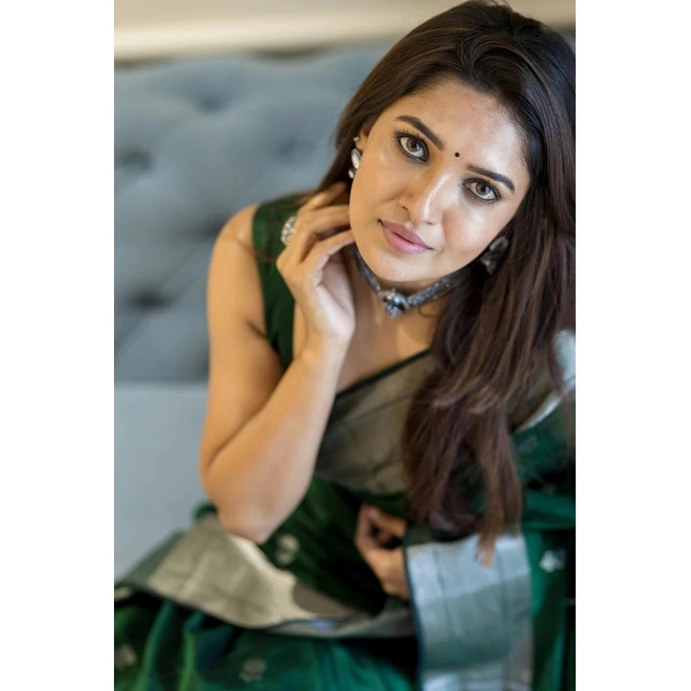 Green cotton printed saree with unstitched blouse, vibrant floral pattern on display