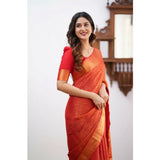 Orange silk printed saree with unstitched blouse (5.5mtr) on model, vibrant floral design for traditional Indian wear