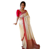 White cotton printed saree with unstitched blouse, vibrant floral design on traditional Indian fabric