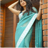 Sky blue cotton printed saree with unstitched blouse, vibrant design on display