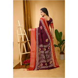 Soft wine blooming marshmallow fabric Kalamkari printed saree with unstitched blouse on hanger