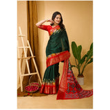 Green soft dola cotton kalamkari printed saree with unstitched blouse, traditional Indian women's attire on mannequin