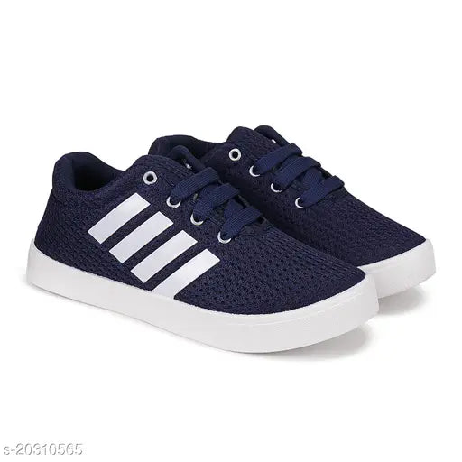 Navy blue canvas running shoe for kids, PVC sole, lace-up fastening detail on display stand