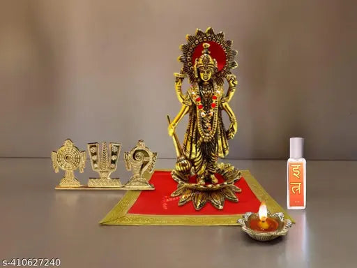 Premium aluminum gold-finished Chaturbahu Vishnu standing on lotus flower religious figurine, DIYA/oil lamp and moti mala on red velvet carpet puja chowki ornament for Satya Narayan vrat katha, ekadashi, Lakshmi. Indian handicraft sculpture of Bhagwan Vishnu in spiritual decor