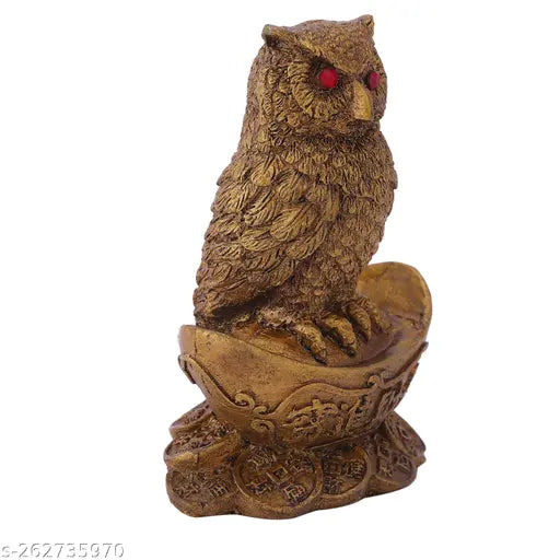 Synthetic resin Vastu owl statue sitting on gold Yuan Bao, symbolizing wealth and good fortune in Indian Feng Shui and Hinduism
