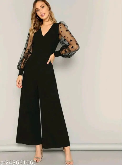 Lycra wide-leg jumpsuit with star mesh sleeves and solid net pattern, available in various sizes (XS-XXXXL). Indian made, stylish outfit on model