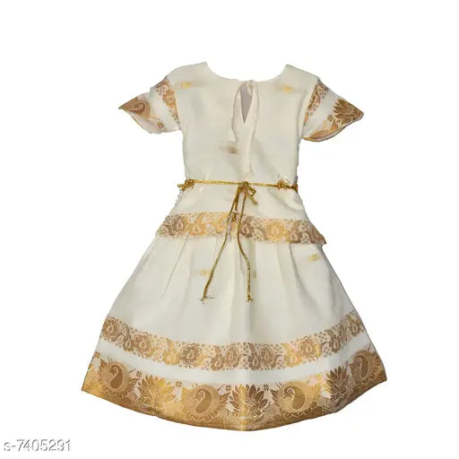 Pink and gold printed cotton silk lehenga choli for kids (6-12 months), solid net dupatta on display
