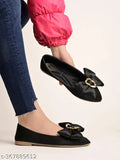 Black synthetic slip-on ballerinas by Shoetopia, featuring oversized bow detail and pointed toe, ideal for women's fashionable footwear