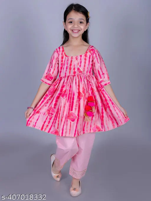 Pink cotton tie-dye, golden foil print Anarkali/Flared Kurta & Pant set for girls, 90% cotton, 10% polyester. Comfortable and durable clothing with knee-length top and three-quarter sleeves. Various sizes available from 12 months to 9-10 years, gentle machine wash, India origin
