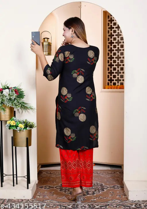 Rayon printed kurta set with palazzos for women, three-quarter sleeves and round neck, trendy Indian fashion on display