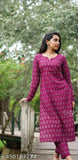 Pink viscose rayon kurti and pants with long sleeves, printed net pattern on a mannequin