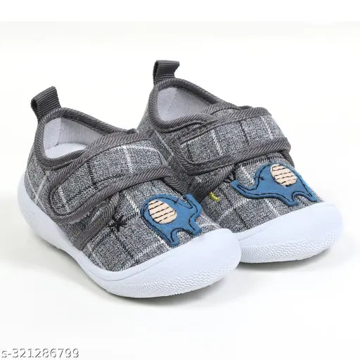 Grey canvas and rubber Chu Chu shoes with Velcro fastening for unisex kids (3 months to 5 years), featuring anti-slip sole, casual design, and easy hook-and-loop closure for first walking shoes for indoor or outdoor use