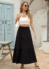 Black rayon skirt, simple design with solid pattern. Women's clothing item available in sizes S-XXL. Made in India