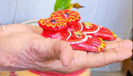 Red terracotta clay Lakshmi Charan Paduka handicraft for prosperity and wealth, Synthetic resin showpiece for Diwali puja (Set of 1)