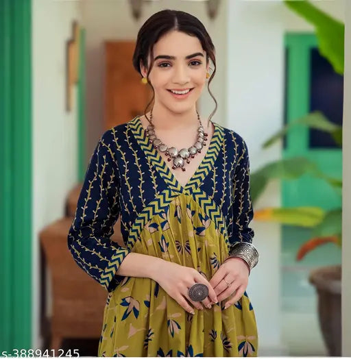 Yellow rayon kurti gown with botanical print, three-quarter sleeves. Vibrant and stylish party wear