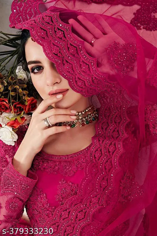 Pink embroidered net lehenga choli and dupatta set, semi-stitched with 44m waist, 42m length, and 2.2m dupatta length, Indian wedding wear on display