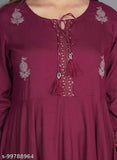 Purple rayon flared kurti with tussles, three-quarter sleeves, solid design. M (38in), L (40in), XL (42in), XXL (44in). Indian ethnic wear fashion