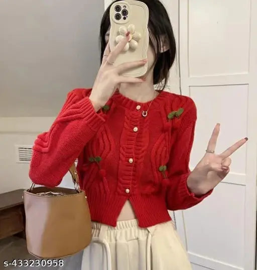 Imported red wool cropped cardigan sweater with embroidered net cherry pattern, long sleeves. Cozy winter wear on display
