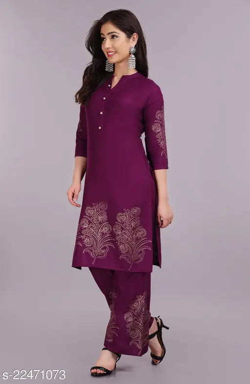Colorblocked rayon kurta set with palazzos, three-quarter sleeves, and gold print stitching. Indian hand block printed fashion for women