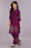 Colorblocked rayon kurta set with palazzos, three-quarter sleeves, and gold print stitching. Indian hand block printed fashion for women