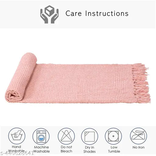 Reversible pink acrylic throw with geometric pattern, perfect for all-season comfort and versatile usage. Handcrafted in India