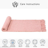 Reversible pink acrylic throw with geometric pattern, perfect for all-season comfort and versatile usage. Handcrafted in India