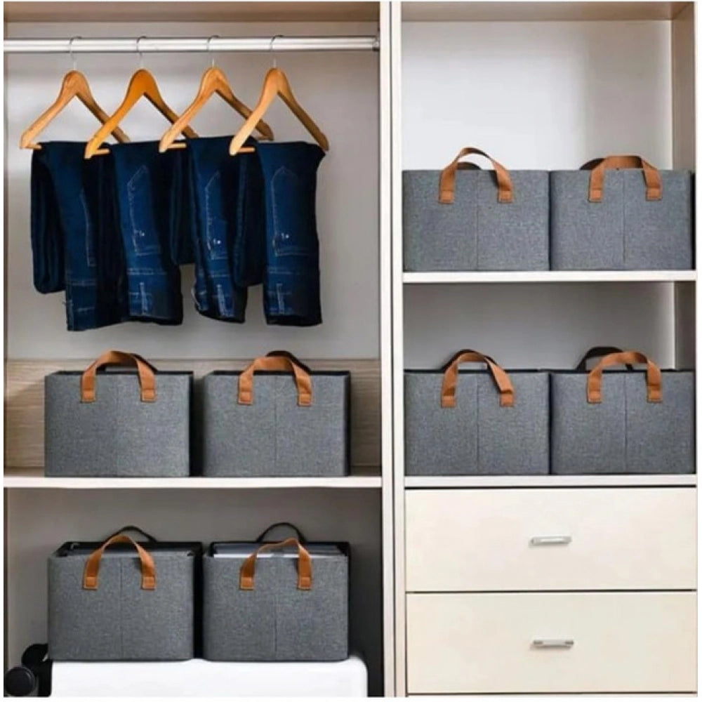 Multicolor foldable cloth organizer box with handle. Ideal for storing clothes, toys, books, accessories, and household essentials. Strong side handles allow easy lifting, moving, and placement. Suitable for wardrobes, shelves, kids' rooms, closets, and storage cabinets. Handle with care for decorative or personal use only